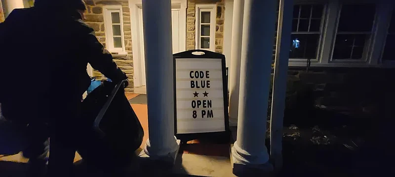 A man caries a bag of donated laundry into the Lansdale “Code Blue” shelter for men on Wednesday, Dec. 4, 2024.