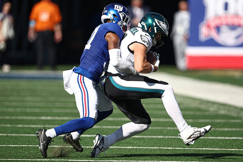 Oct 20, 2024; East Rutherford, New Jersey, USA; Philadelphia Eagles tight end Grant Calcaterra (81) is tackled by New York Giants safety Tyler Nubin (31) during the first half at MetLife Stadium. Mandatory Credit: Vincent Carchietta-Imagn Images