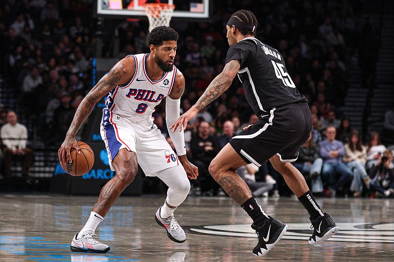 Jan 4, 2025; Brooklyn, New York, USA; Philadelphia 76ers forward Paul George (8) is guarded by Brooklyn Nets guard Keon Johnson (45) during the first half at Barclays Center. Mandatory Credit: Vincent Carchietta-Imagn Images