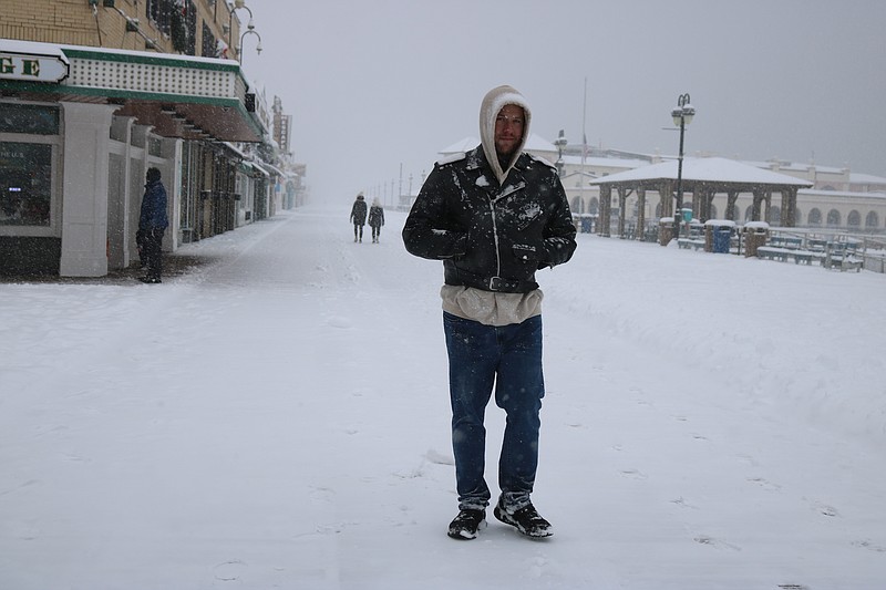 Ocean City resident Casey Shackelford is virtually all by himself on the Boardwalk during the snowstorm.