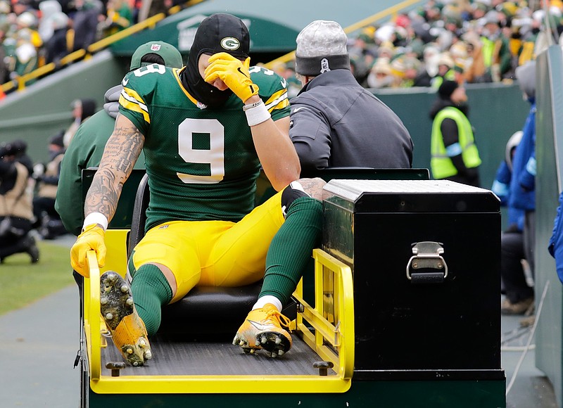 Green Bay Packers wide receiver Christian Watson (9) leaves the field on a cart after getting injured against the Chicago Bears in the second quarter during their football game Sunday, January 5, 2025, at Lambeau Field in Green Bay, Wisconsin.