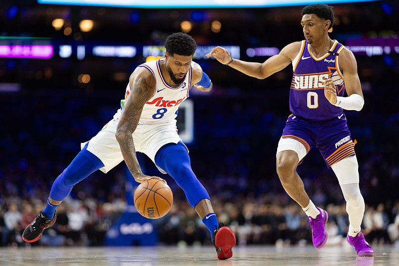 Jan 6, 2025; Philadelphia, Pennsylvania, USA; Philadelphia 76ers forward Paul George (8) controls the ball against Phoenix Suns forward Ryan Dunn (0) during the first quarter at Wells Fargo Center. Mandatory Credit: Bill Streicher-Imagn Images