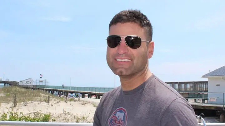 Adam Coste is pictured with the Ocean City Fishing Club Pier in the background. (Photo courtesy of GoFundMe)