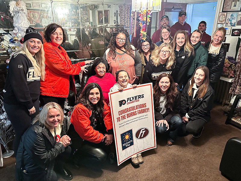 Flyers Charities and some of the Flyers wives surprised Ronda Burns, 8, and her family to remodel their Philadelphia home.