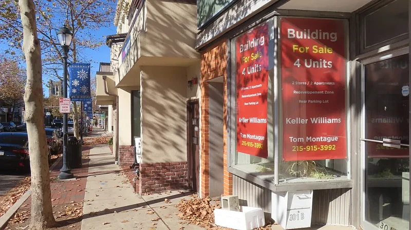 A ‘building for sale’ sign is seen on Main Street in Lansdale in Nov. 2024.