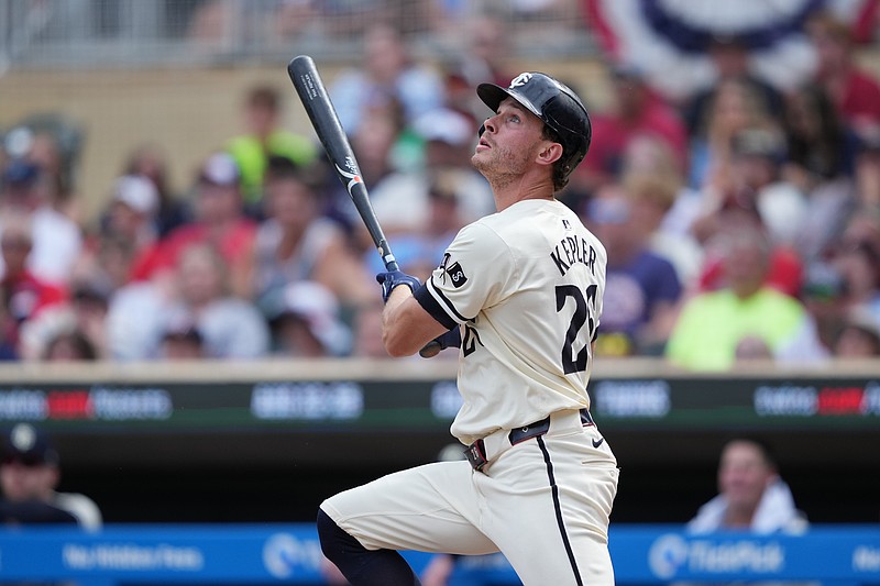 Aug 11, 2024; Minneapolis, Minnesota, USA; Minnesota Twins right fielder Max Kepler (26) hits a single during the ninth inning against the Cleveland Guardians at Target Field. Mandatory Credit: Jordan Johnson-USA TODAY Sports