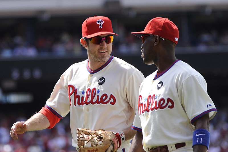 Jul 05, 2009; Philadelphia, PA, USA; Philadelphia Phillies second baseman Chase Utley (left) and shortstop Jimmy Rollins (right) walk off the field during the eighth inning against the New York Mets at Citizens Bank Park. The Philadelphia Phillies defeated the the New York Mets 2-0. Mandatory Credit: Howard Smith-USA TODAY Sports