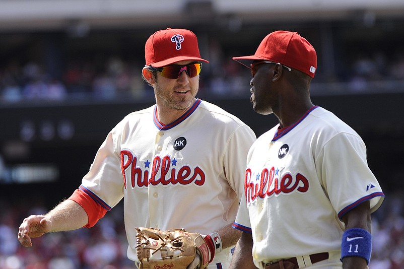 Jul 05, 2009; Philadelphia, PA, USA; Philadelphia Phillies second baseman Chase Utley (left) and shortstop Jimmy Rollins (right) walk off the field during the eighth inning against the New York Mets at Citizens Bank Park. The Philadelphia Phillies defeated the the New York Mets 2-0. Mandatory Credit: Howard Smith-USA TODAY Sports