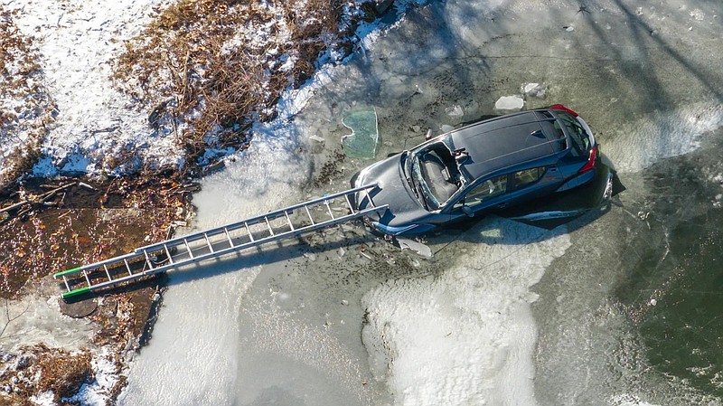 A car is sinking in the pond near the Willow Grove YMCA.