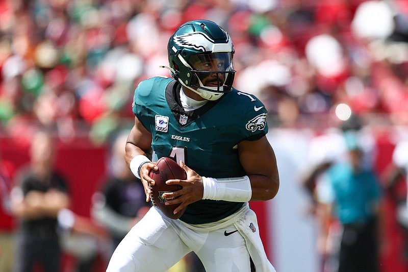 Sep 29, 2024; Tampa, Florida, USA; Philadelphia Eagles quarterback Jalen Hurts (1) drops back to p[ass against the Tampa Bay Buccaneers in the second quarter at Raymond James Stadium. Mandatory Credit: Nathan Ray Seebeck-Imagn Images