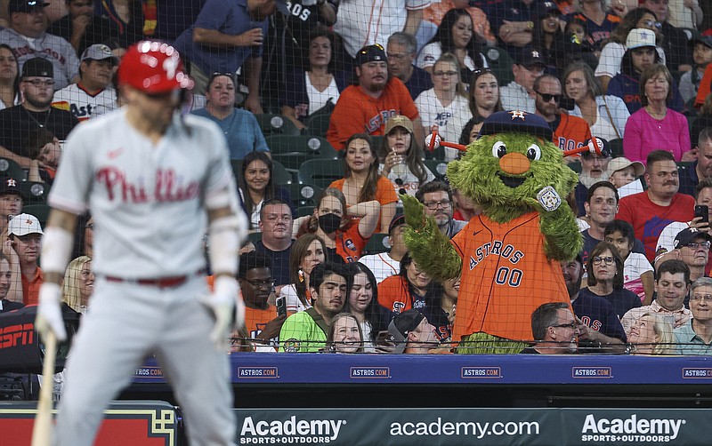 Apr 30, 2023; Houston, Texas, USA; Houston Astros mascot Orbit performs while Philadelphia Phillies right fielder Nick Castellanos (8) bats during the game at Minute Maid Park. Mandatory Credit: Troy Taormina-USA TODAY Sports