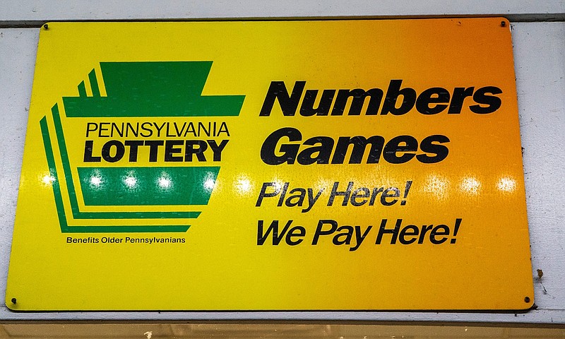 A Pennsylvania Lottery sign hangs outside of the 7/11 in Levittown on Monday, Dec. 23, 2024.