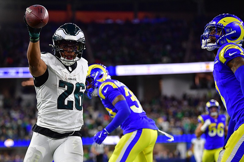 Nov 24, 2024; Inglewood, California, USA; Philadelphia Eagles running back Saquon Barkley (26) reacts after getting first down against the Los Angeles Rams during the second half at SoFi Stadium. Mandatory Credit: Gary A. Vasquez-Imagn Images