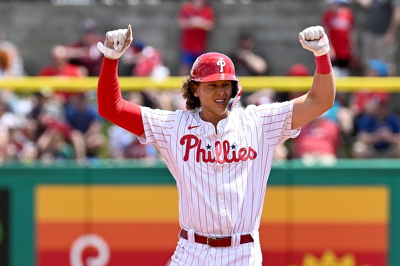 Mar 24, 2024; Clearwater, Florida, USA; Philadelphia Phillies third baseman Alec Bohm (28) reacts after hitting a RBI double  in the first inning of the spring game against the Toronto Blue Jays  at BayCare Ballpark. Mandatory Credit: Jonathan Dyer-USA TODAY Sports