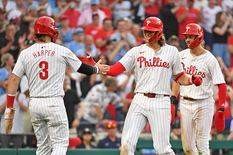 Jun 17, 2024; Philadelphia, Pennsylvania, USA; Philadelphia Phillies third base Alec Bohm (28) celebrates his home run with first base Bryce Harper (3) and shortstop Trea Turner (7) during the fifth inning against the San Diego Padres at Citizens Bank Park. Mandatory Credit: Eric Hartline-USA TODAY Sports