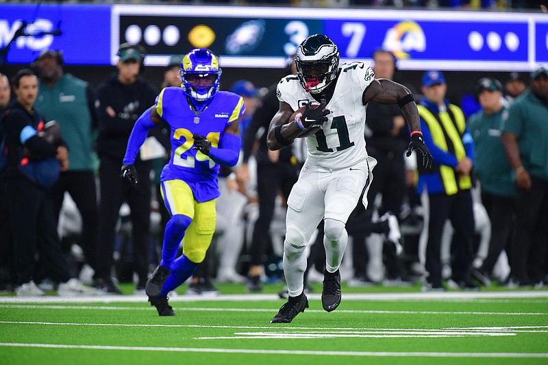 Nov 24, 2024; Inglewood, California, USA; Philadelphia Eagles wide receiver A.J. Brown (11) runs the ball against the Los Angeles Rams during the first half at SoFi Stadium. Mandatory Credit: Gary A. Vasquez-Imagn Images