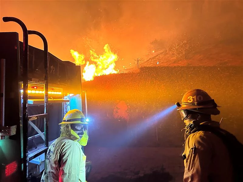 Firefighters battle the flames last week at Angeles National Forest. (Credit: U.S. Forest Service)