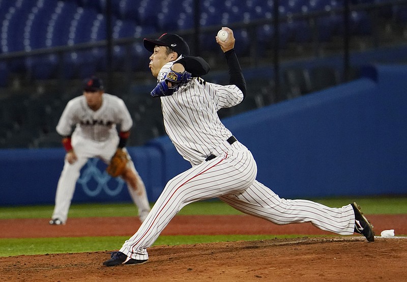 Aug 2, 2021; Yokohama, Japan; Team Japan pitcher Koyo Aoyagi (12) throws a pitch against the USA in a second round baseball game during the Tokyo 2020 Olympic Summer Games at Yokohama Baseball Stadium. Mandatory Credit: Mandi Wright-USA TODAY Sports