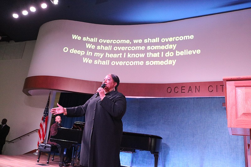 From the stage of the Ocean City Tabernacle, soloist Alicia Gadson leads the audience in song while accompanied by pianist Durrell Rose.