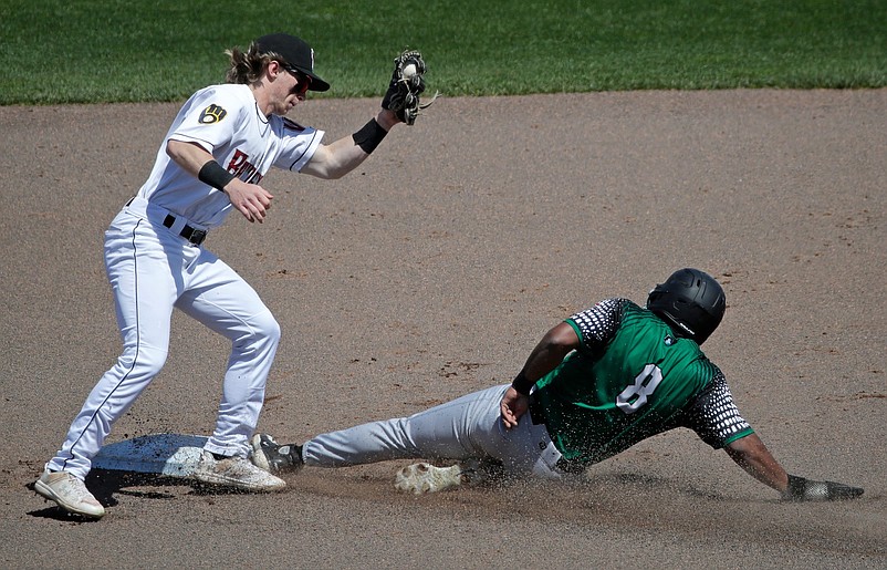 Great Lakes Loons' Dylan Campbell (8) is safe at second base against Wisconsin Timber Rattlers' Dylan O'Rae (3) Wednesday, May 1, 2024, at Neuroscience Group Field at Fox Cities Stadium in Grand Chute, Wisconsin. The Great Lakes Loons won 9-8.