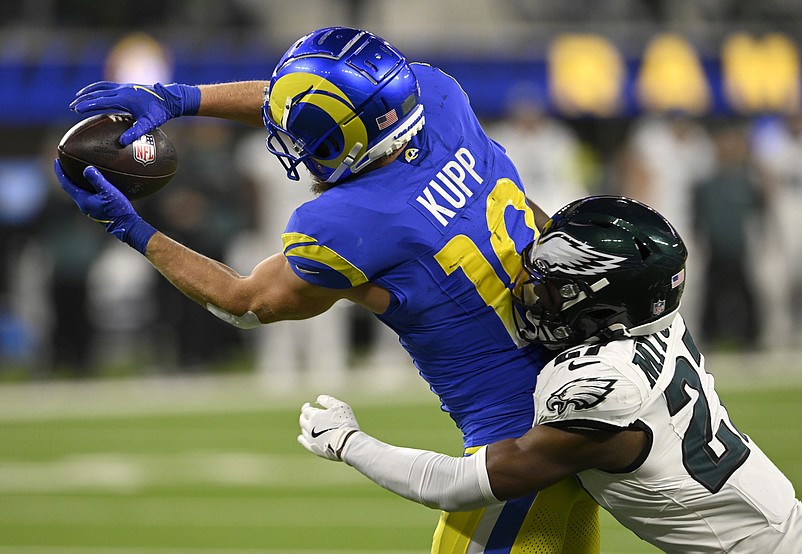 Nov 24, 2024; Inglewood, California, USA;  Los Angeles Rams wide receiver Cooper Kupp (10) catches a touchdown pass against Philadelphia Eagles cornerback Quinyon Mitchell (27) during the second half at SoFi Stadium. Mandatory Credit: Alex Gallardo-Imagn Images