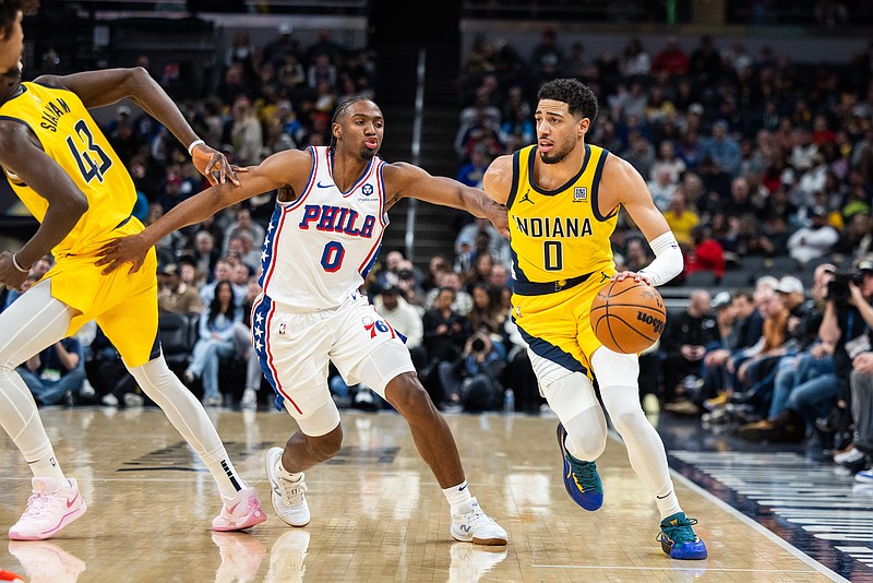 Jan 18, 2025; Indianapolis, Indiana, USA; Indiana Pacers guard Tyrese Haliburton (0) dribbles the ball while Philadelphia 76ers guard Tyrese Maxey (0) defends in the first half at Gainbridge Fieldhouse. Mandatory Credit: Trevor Ruszkowski-Imagn Images