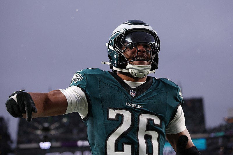 Jan 19, 2025; Philadelphia, Pennsylvania, USA; Philadelphia Eagles running back Saquon Barkley (26) celebrates after scoring a touchdown against the Los Angeles Rams in the first half in a 2025 NFC divisional round game at Lincoln Financial Field. Mandatory Credit: Bill Streicher-Imagn Images