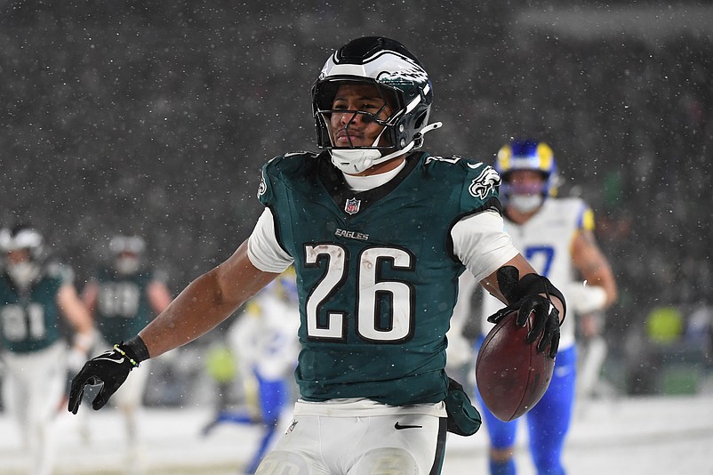 Jan 19, 2025; Philadelphia, Pennsylvania, USA; Philadelphia Eagles running back Saquon Barkley (26) celebrates after scoring a touchdown against the Los Angeles Rams in the second half in a 2025 NFC divisional round game at Lincoln Financial Field. Mandatory Credit: Eric Hartline-Imagn Images