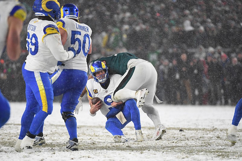 Jan 19, 2025; Philadelphia, Pennsylvania, USA; Los Angeles Rams quarterback Matthew Stafford (9) is sacked by Philadelphia Eagles defensive tackle Jalen Carter (98) during the fourth quarter in a 2025 NFC divisional round game at Lincoln Financial Field. Mandatory Credit: Eric Hartline-Imagn Images