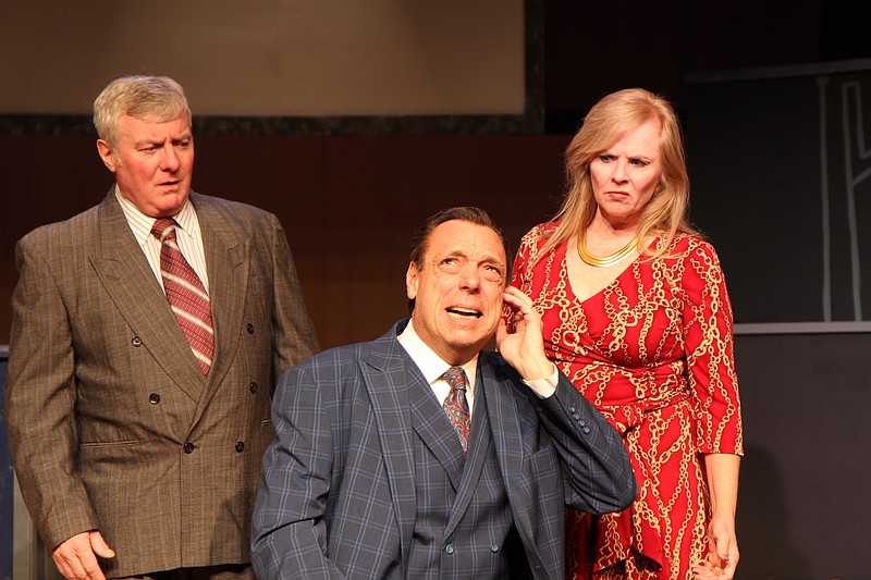 Howard Beale (Kevin McPeak) is tuning out the consultation of his best friend Max Schumacher (Eric Jarrell) and his wife Louise Schumacher (Cathy Gibbons-Mostek).