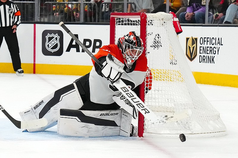 Jan 2, 2025; Las Vegas, Nevada, USA; Philadelphia Flyers goaltender Aleksei Kolosov (35) controls a Vegas Golden Knights shot during the second period at T-Mobile Arena. Mandatory Credit: Stephen R. Sylvanie-Imagn Images