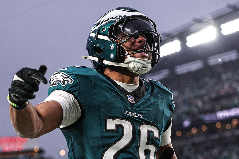 Jan 19, 2025; Philadelphia, Pennsylvania, USA; Philadelphia Eagles running back Saquon Barkley (26) reacts to his touchdown against the Los Angeles Rams in a 2025 NFC divisional round game at Lincoln Financial Field. Mandatory Credit: Bill Streicher-Imagn Images