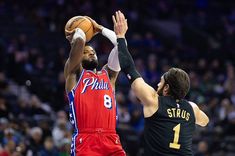 Jan 24, 2025; Philadelphia, Pennsylvania, USA; Philadelphia 76ers forward Paul George (8) shoots against Cleveland Cavaliers guard Max Strus (1) during the first quarter at Wells Fargo Center. Mandatory Credit: Bill Streicher-Imagn Images