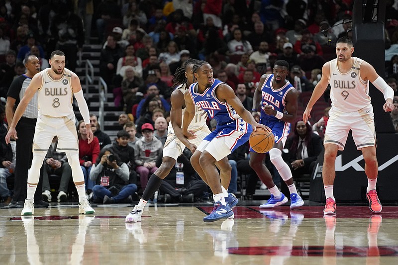 Jan 25, 2025; Chicago, Illinois, USA; Chicago Bulls guard Ayo Dosunmu (11) defends Philadelphia 76ers guard Tyrese Maxey (0) during the first quarter at United Center. Mandatory Credit: David Banks-Imagn Images