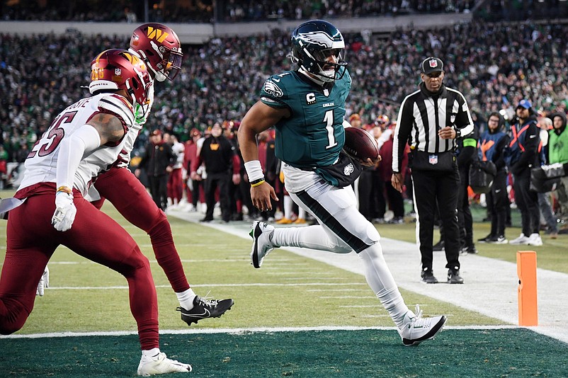 Jan 26, 2025; Philadelphia, PA, USA; Philadelphia Eagles quarterback Jalen Hurts (1) runs with the ball for a touchdown against the Washington Commanders during the second half in the NFC Championship game at Lincoln Financial Field. Mandatory Credit: Eric Hartline-Imagn Images