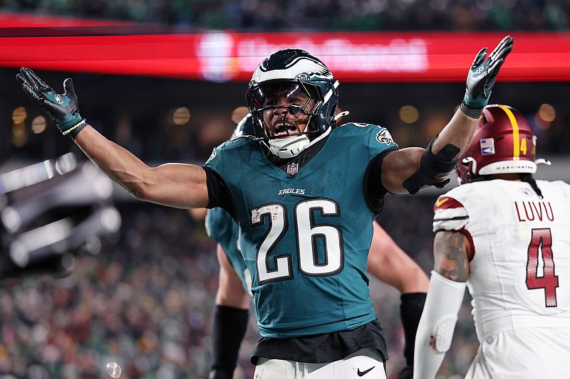 Jan 26, 2025; Philadelphia, PA, USA; Philadelphia Eagles running back Saquon Barkley (26) celebrates after a touchdown against the Washington Commanders during the second half in the NFC Championship game at Lincoln Financial Field. Mandatory Credit: Bill Streicher-Imagn Images