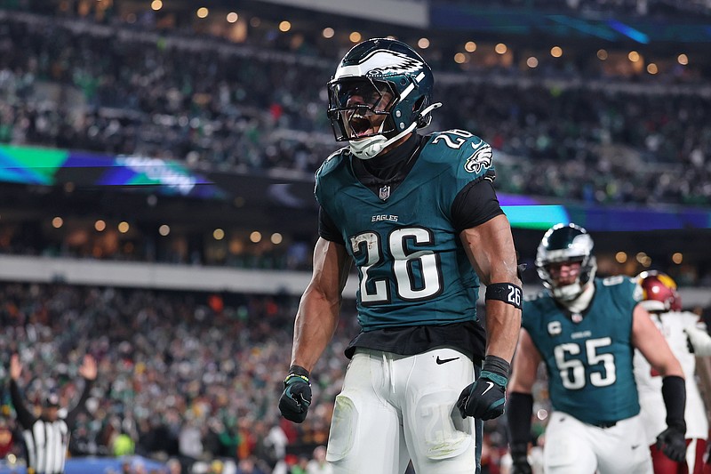 Jan 26, 2025; Philadelphia, PA, USA; Philadelphia Eagles running back Saquon Barkley (26) celebrates after a touchdown against the Washington Commanders during the second half in the NFC Championship game at Lincoln Financial Field. Mandatory Credit: Bill Streicher-Imagn Images