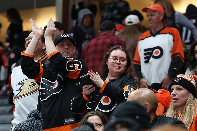 Dec 28, 2024; Anaheim, California, USA; Philadelphia Flyers fans celebrate a win after defeating the Anaheim Ducks 3-1 at Honda Center. Mandatory Credit: Kiyoshi Mio-Imagn Images