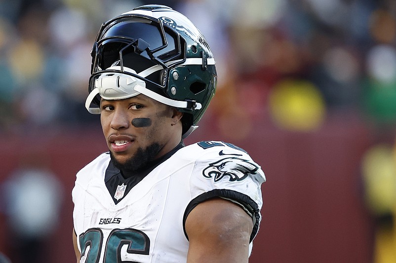 Dec 22, 2024; Landover, Maryland, USA; Philadelphia Eagles running back Saquon Barkley (26) stands on the field during a timeout against the Washington Commanders during the third quarter at Northwest Stadium. Mandatory Credit: Geoff Burke-Imagn Images