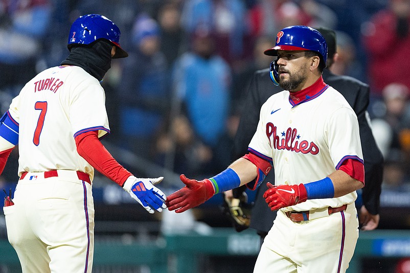 Apr 3, 2024; Philadelphia, Pennsylvania, USA; Philadelphia Phillies designated hitter Kyle Schwarber (12) is congratulated by shortstop Trea Turner (7) after hitting a home run during the sixth inning against the Cincinnati Reds at Citizens Bank Park. Mandatory Credit: Bill Streicher-USA TODAY Sports