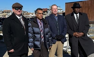 Bob McDevitt, second from right, is leading a ticket that includes, from left, John Devlin, Akbar Hussain and Steve Young.