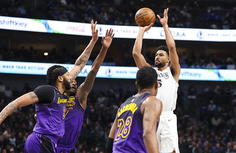 Jan 7, 2025; Dallas, Texas, USA; Dallas Mavericks guard Quentin Grimes (5) shoots over Los Angeles Lakers forward Anthony Davis (3) during the first half at American Airlines Center. Mandatory Credit: Kevin Jairaj-Imagn Images