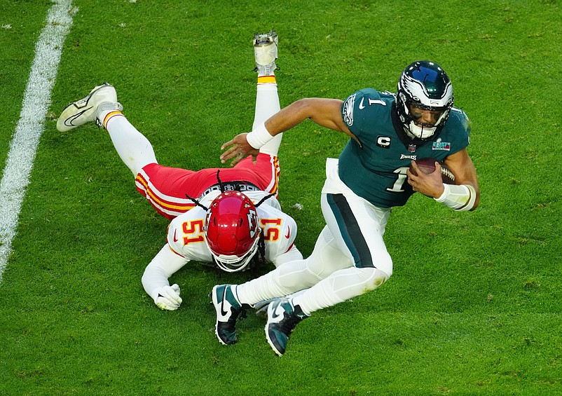 Eagles quarterback Jalen Hurts scrambles for extra yardage during the first half of Super Bowl 57 against the Chiefs on Feb. 12, 2023.