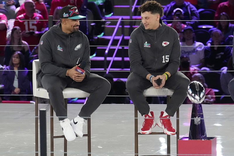 Feb 6, 2023; Phoenix, Ariz., U.S.;   Philadelphia Eagles quarterback Jalen Hurts and Kansas City Chiefs quarterback Patrick Mahomes chat on stage during Super Bowl Opening Night at Footprint Center. Mandatory Credit: Michael Chow-Arizona Republic