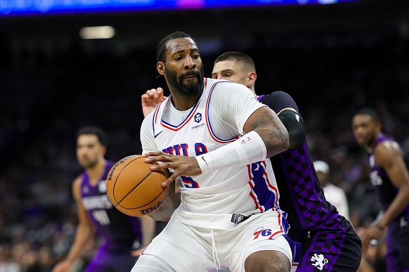 Jan 1, 2025; Sacramento, California, USA; Philadelphia 76ers center Andre Drummond (5) drives to the basket against Sacramento Kings center Alex Len (25) during the second quarter at Golden 1 Center. Mandatory Credit: Sergio Estrada-Imagn Images