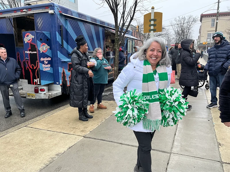 Sandy Milito, a Montgomery County Human Resources employee, is pictured holding pom poms while attending a Feb. 6, 2025 Eagles pep rally in Norristown ahead of the Super Bowl.