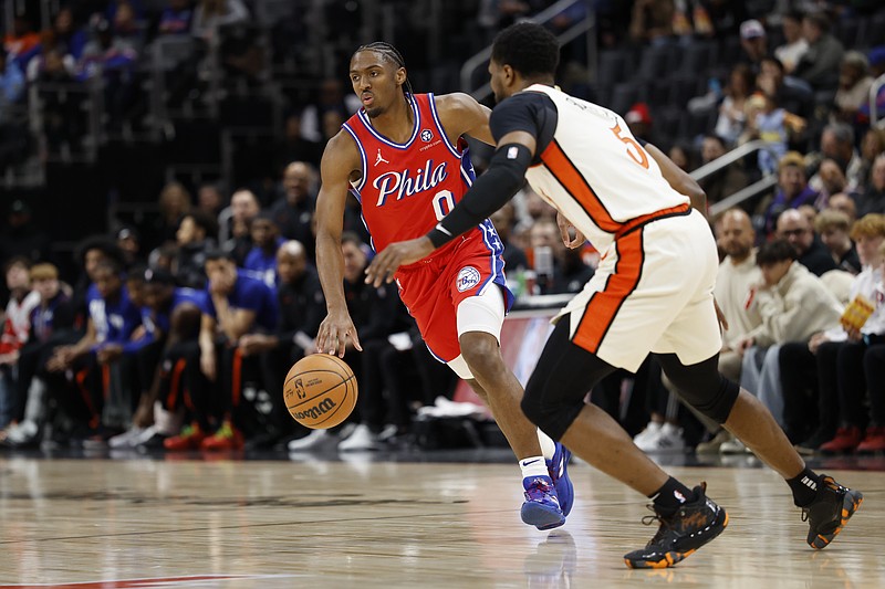 Feb 7, 2025; Detroit, Michigan, USA; Philadelphia 76ers guard Tyrese Maxey (0) dribbles defended by Detroit Pistons guard Malik Beasley (5) in the first half at Little Caesars Arena. Mandatory Credit: Rick Osentoski-Imagn Images