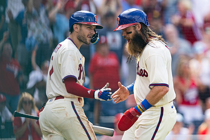 Jul 15, 2023; Philadelphia, Pennsylvania, USA; Philadelphia Phillies center fielder Brandon Marsh (16) celebrates with shortstop Trea Turner (7) after scoring during the eighth inning against the San Diego Padres at Citizens Bank Park. Mandatory Credit: Bill Streicher-USA TODAY Sports