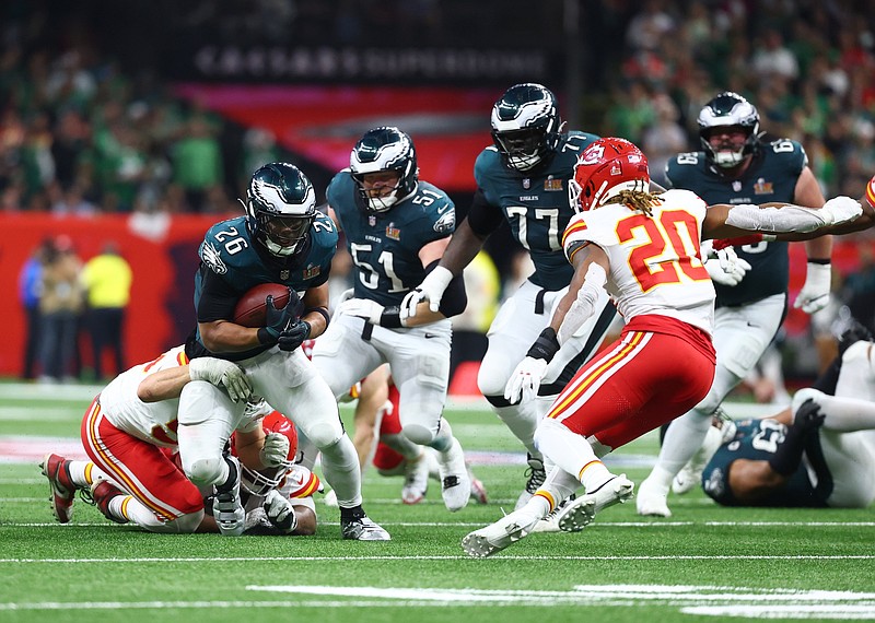 Feb 9, 2025; New Orleans, LA, USA; Philadelphia Eagles running back Saquon Barkley (26) runs the ball against the Kansas City Chiefs in the second half in Super Bowl LIX at Ceasars Superdome. Mandatory Credit: Mark J. Rebilas-Imagn Images