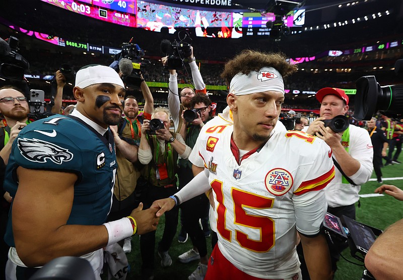 Feb 9, 2025; New Orleans, LA, USA; Philadelphia Eagles quarterback Jalen Hurts (1) shakes hands with Kansas City Chiefs quarterback Patrick Mahomes (15) after Super Bowl LIX at Ceasars Superdome. Mandatory Credit: Mark J. Rebilas-Imagn Images